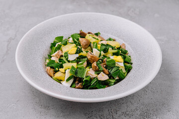 Fresh salad with egg and mushrooms on plate