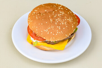 Big tasty burger with beef cutlet on a plate. Hamburger, cheeseburger with mushroom. Crispy chicken burger.
