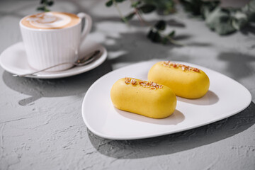 Lemon dessert and coffee on modern table