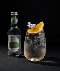 Elegant gin tonic cocktail with orange slice
