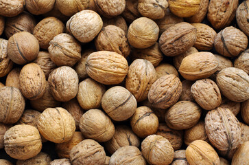 Top view of whole walnuts as background texture