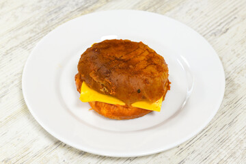 Big tasty burger with beef cutlet on a plate. Hamburger, cheeseburger with mushroom. Crispy chicken burger.