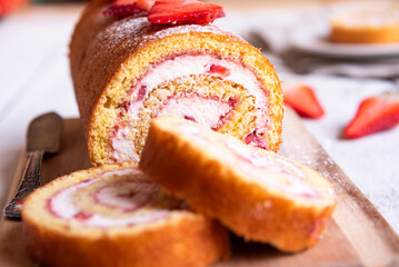 Swiss roll with strawberries and cream, homemde dessert - 789940322