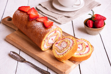 Swiss roll with strawberries and cream, homemde dessert - 789940557