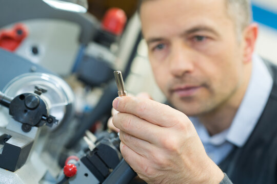 worker looking at a key