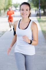 a woman is jogging outdoors