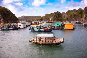 Floating fishing village in sea bay in Vietnam, boats and islands - 789951358