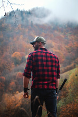 Handsome Serious Strong Young Man in Plaid Shirt and Cap - 789964536