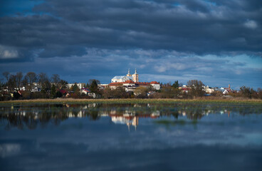 Panorama of the city of Krasnystaw in spring from the side of flooded meadows - obrazy, fototapety, plakaty