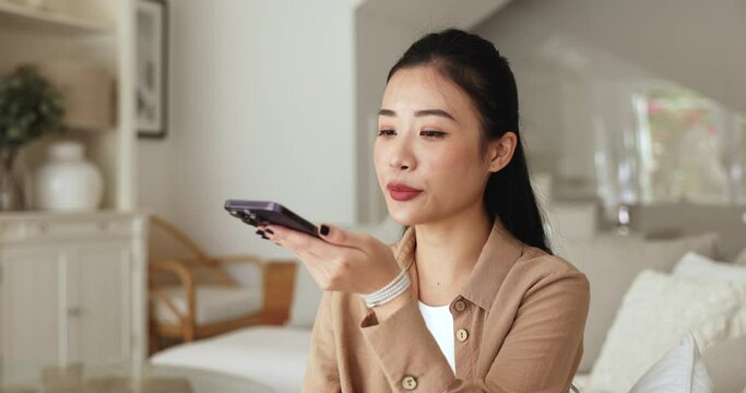 Close up woman holds smartphone talk on speakerphone, use virtual assistant, share audio messages to friend, manage tasks or communicate with family remotely, leave voicemail engaged in daily activity