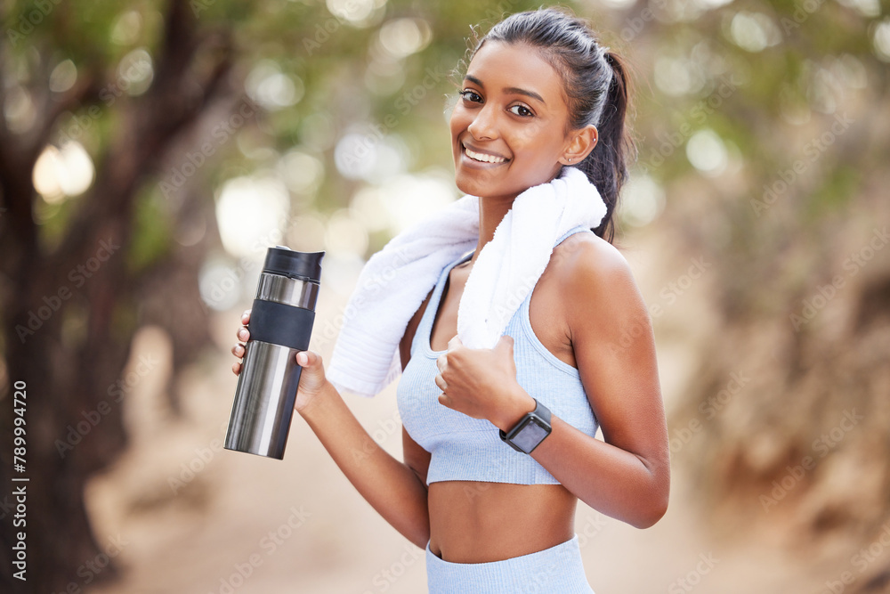 Wall mural Fitness, running and portrait of woman with water in park for training, break or hydration after cardio in nature. Sports, liquid and thirsty runner in forest with body, recovery or health drink