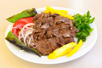 Lavash zurna doner kebab ( zurna  durum )  or shawarma sliced in plate isolated.  hatay usulu tavuk Et doner durum. Gobit ekmek arasi doner. Pilavustu iskender doner kebap. 