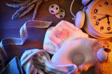 Conceptual background of bedtime for the baby with contrasting lights