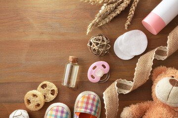 Background with baby grooming accessories on wooden table
