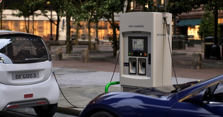 Generic electric vehicle charging at station dock point near parking lot. City street charging station provides an eco-friendly sustainable power supply for EV cars.