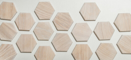 Wooden honeycomb made of light walnut, coated with colored varnish. Hexagon in interior design....