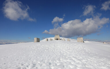 Pieve, TV, Italy - March 13, 2024: Military Ossuary Memorial of Monte Grappa and white snow