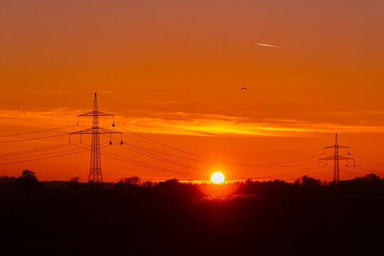 Sunset with overland high voltage lines at Huett, Eichendorf, Dingolfing-Landau, Bavaria, Germany