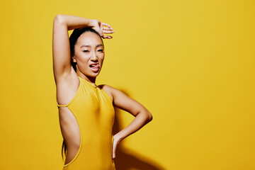 Yellow woman fashion summer beauty portrait smile brunette swimsuit shocked surprised trendy