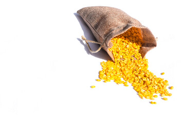 yellow moong dal, dried yellow lentils in sacks with bushels on a light background, Dried soybean...
