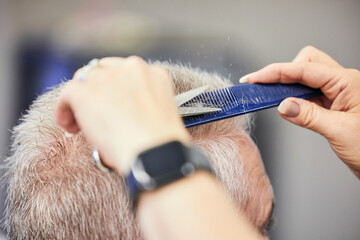Hands, scissors and mature man in salon for haircut by hairdresser, barber and hair care service....