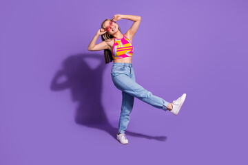 Photo of charming positive cool girl wear trendy clothes enjoy weekend dance night club isolated on purple color background