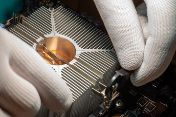 Aluminum cooling radiator with copper core mounted with a clamp by skilled service staff on the computer processor