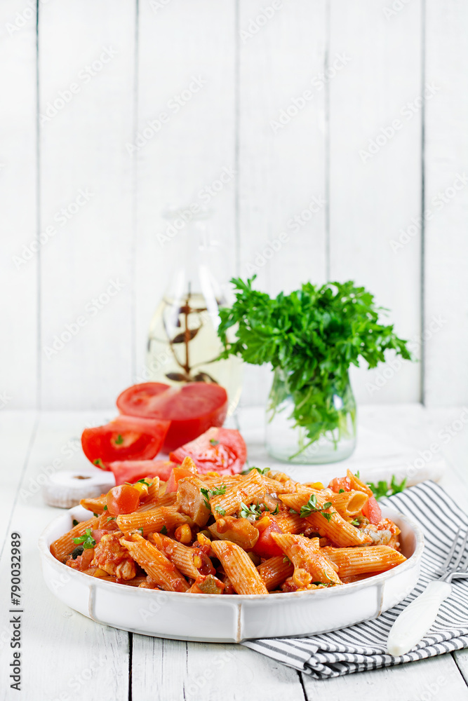 Canvas Prints classic italian pasta penne arrabbiata with vegetables on white wooden table. penne pasta with sauce