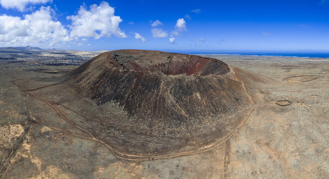 High aspect aerial panoramic view of Volcan Calderon Hondo volcano and crater near Lajares Corralejo in Fuerteventura Canary Islands Spain