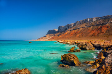 Fototapeta na wymiar coast of an island in the Indian Ocean. Emerald water, pristine beaches, wild rocky shores. Amazing landscape. Yemen. Socotra.