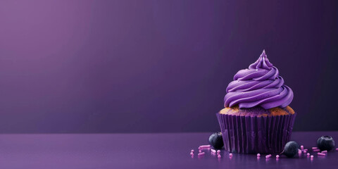 Royal purple banner with a cupcake on the side with space for copy space. - obrazy, fototapety, plakaty