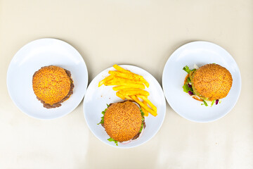 Big tasty burger with beef cutlet on a plate. Crispy chicken burger.