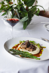 Appetizing medallions with mashed potatoes and asparagus. Restaurant serving, banquet, food photography