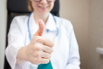 Doctor thumbs up, medical professional showing approval, healthcare success