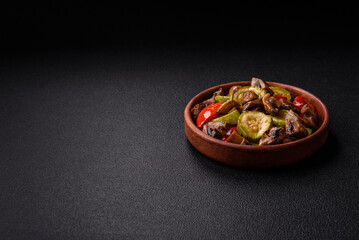 Delicious fresh grilled vegetables zucchini, bell peppers, mushrooms and onions