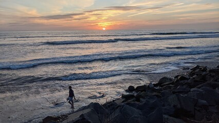Southern California beaches, sunsets, surfers, tide pools and palms trees at Swamis Reef Surf Park...