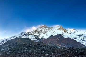 Fototapeta premium Snow capped mountains in himalaya landscape with rocks. Kailash mountain peak in Tibet.