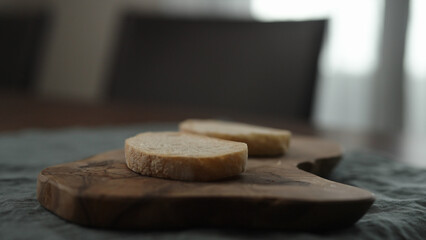 ciabatta bread slice on olive board