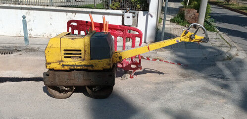 Small hand roller compactor used for road construction and repairs. For example after laying an optic fiber network.