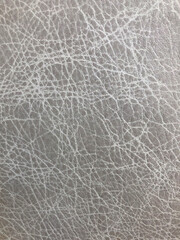 Gray leather background. White and gray leather texture background sofa, armchair, furniture, interior accessories. Macro surface leather pattern, use for background and design work.