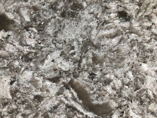 White background made of natural fur. Fabric sample. Abstract texture of white fur background.