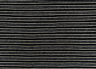 Fabric with a striped pattern, close-up as a texture. Old-fashioned cotton or linen textile with a...