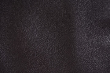 Closeup full grain leather surface with shallow focus