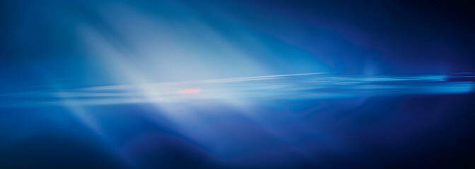 Surreal light streams in a blue gradient background