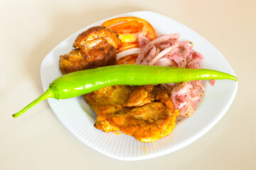 Beef steak grill with rice pilaf, fried potatoes, grilled pepper