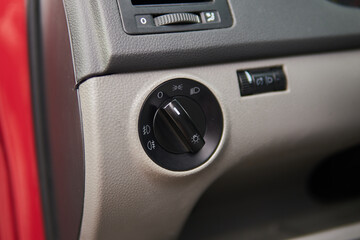 Close-up on the headlight switch control buttons
