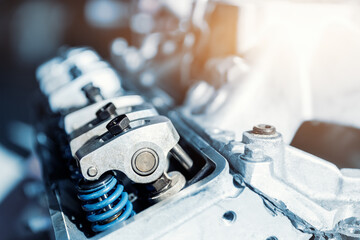 Closeup car racing motorsport v8 engine valve parts springs garage workshop workbench repair...