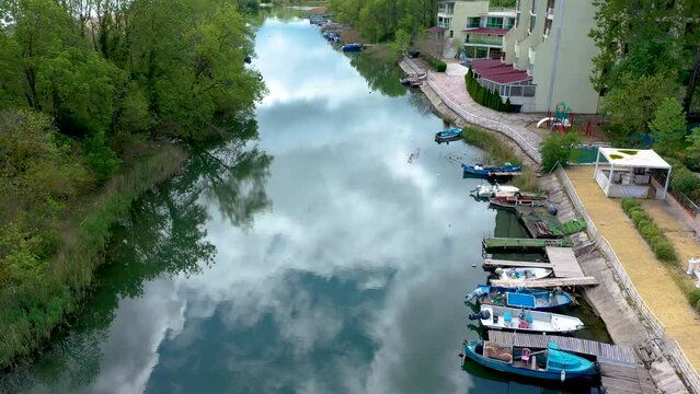 Aerial view to fishing boats on piers in river. Dyavolska river which flows into the Black sea in Primorsko, Bulgaria.