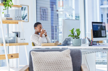 Coffee, business and black woman in office for drinking, planning report or review at desk. Computer, working and female employee with cup of tea for online editing, research article or reading email