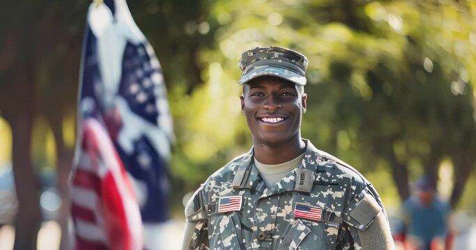 Joyful African American soldier in camouflage with the American flag in the background, representing pride and patriotism